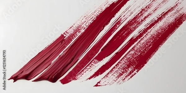 Fototapeta A textured brushstroke in deep red ink, streaking across a blank white page, forming a fluid, artistic expression6