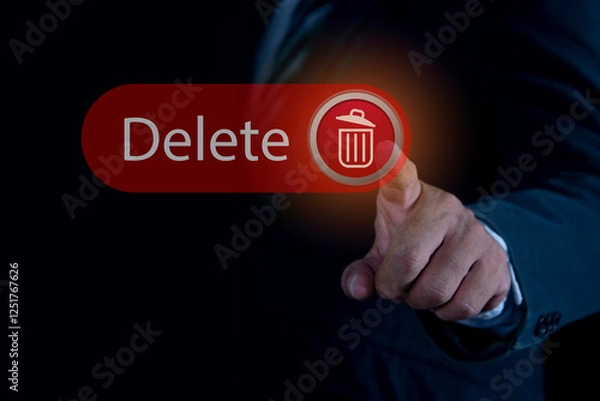 Fototapeta Man pushing the delete button on virtual screen. The concept of deletion or erase contacts, files, informations.
