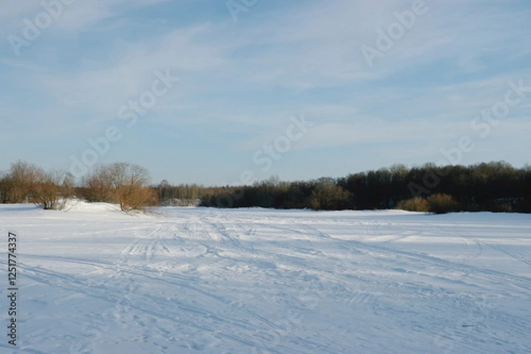 Fototapeta ski track on an ice-bound river