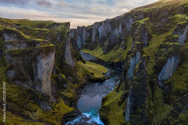 Fototapeta Birdview of Fjadrargljufur canyon with a river meandering through the middle of the canyon. Color landscape in a famous place in Iceland. Scenic nature environment.