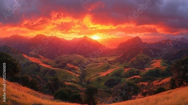 Obraz Dramatic sunset over mountain valley landscape.  Possible use for backgrounds in nature or travel websites