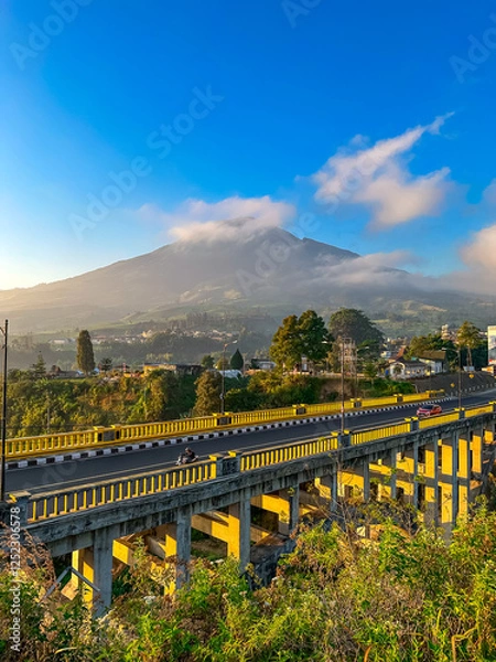 Obraz View of the bridge with the mountain in the background. Sigandul Bridge and Mount Sumbing.