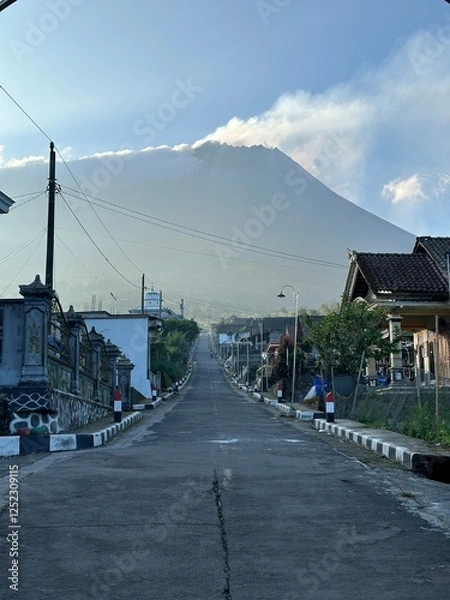 Obraz Beautiful rural view on a mountain slope with Mount Merapi in the background.