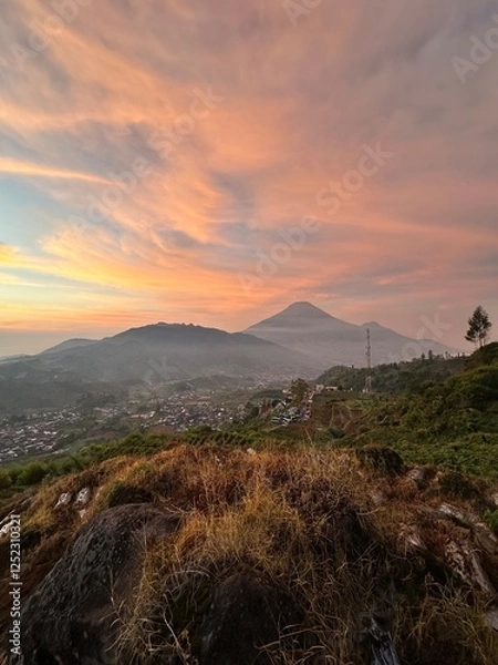 Obraz View of sunrise with reddish sky in a mountainous landscape. Kejajar, Wonosobo, Indonesia.