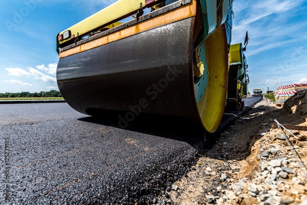Obraz Road roller working on the construction site