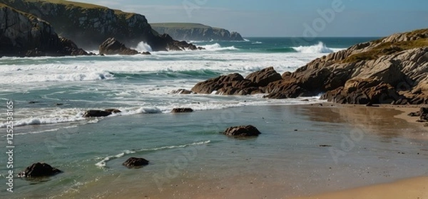 Fototapeta Striking coastal view of seals on a beach, with waves and dramatic cliffs.

