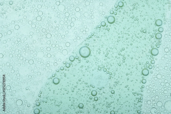 Fototapeta Macro microscope green bubble texture, Close-up Green bubbles and drops oil background . blue green water bubbles, close up golden oil drop for cosmetic...