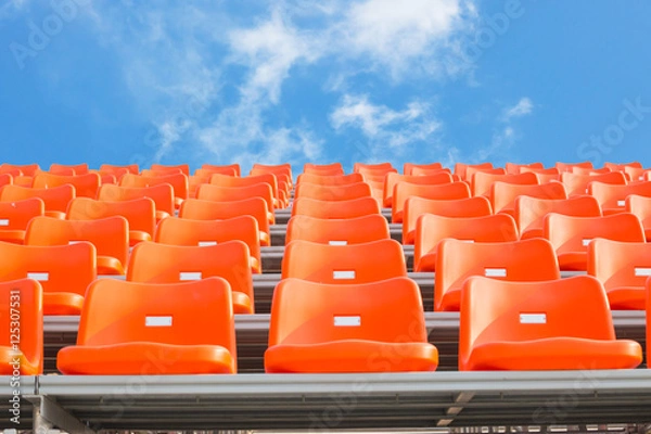Obraz Orange empty stadium seats in arena