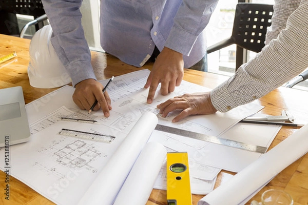 Obraz architect point at blueprint, architectural concept