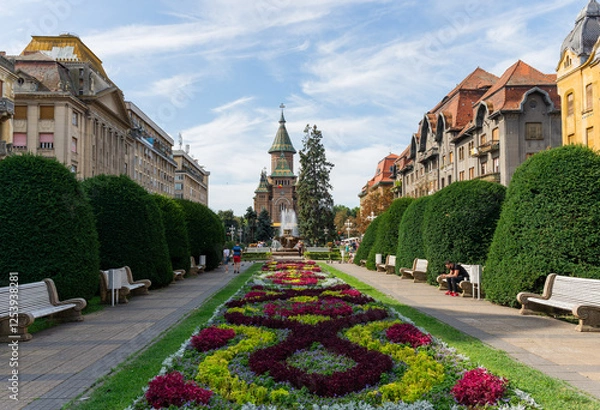Obraz Timisoara,Romania - 15 August 2019 : The center of Timisoara on a sunny day with beautiful blue sky and white clouds