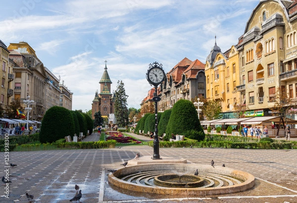 Obraz Timisoara,Romania - 15 August 2019 : The center of Timisoara on a sunny day with beautiful blue sky and white clouds