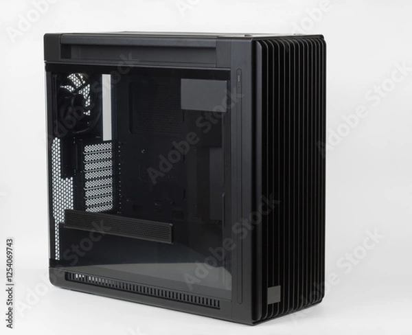 Fototapeta Side view of empty  big tower, PC case, chassis,  tempered-glass left panel has a mesh window to aid in graphics-card ventilation