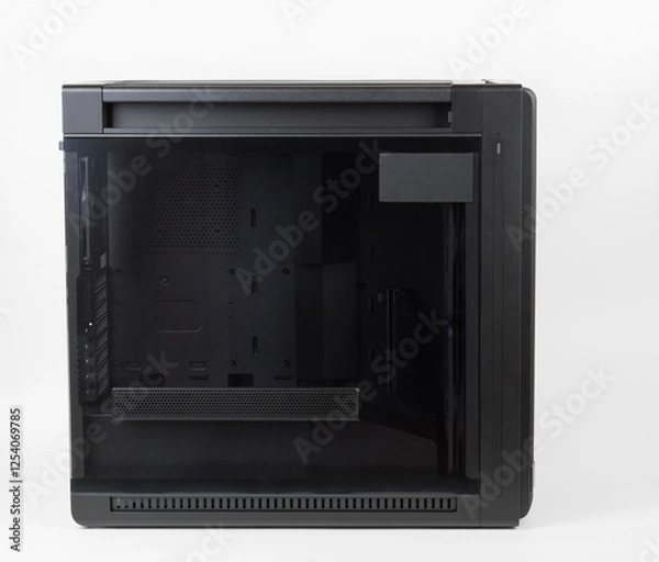Fototapeta Side view of empty  big tower, PC case, chassis,  tempered-glass left panel has a mesh window to aid in graphics-card ventilation