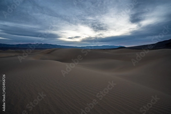 Obraz Sunrise over sand dunes in the Sahara Desert with a scenic, dry landscape and golden sands