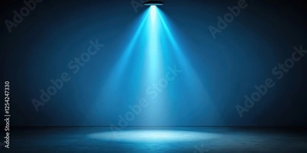 Fototapeta Darkened room with a single blue spotlight illuminating the space, light source