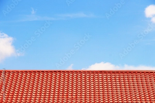 Obraz the red roof and blue sky backgrounds