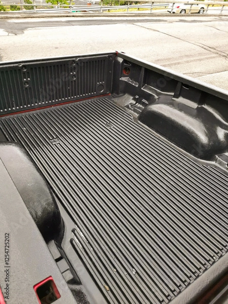 Fototapeta Close-Up of an Empty Pickup Truck Bed with a Textured Liner, Showcasing Cargo Space and Durability for Heavy-Duty Transport