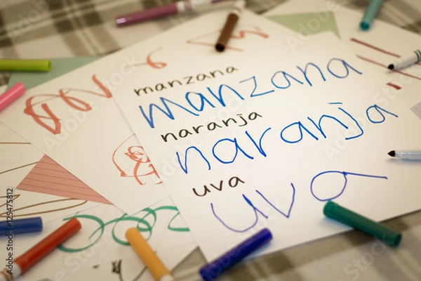 Fototapeta Spanish; Kids Writing Name of the Fruits for Practice