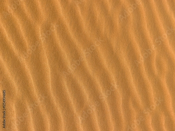 Fototapeta Sand. Texture, surface of sea sand. Natural background. Close-up. Waves of sand. Dunes. Copy space
