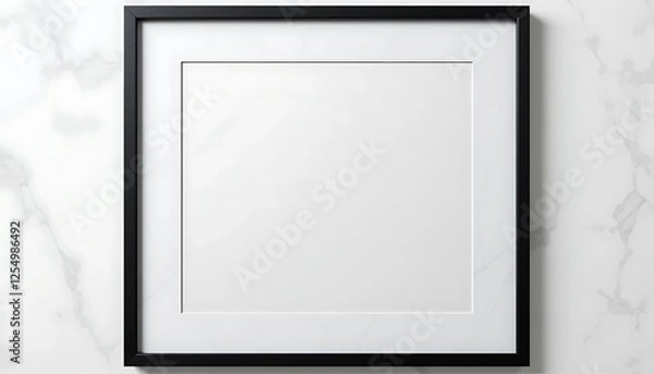 Fototapeta Blank modern black square picture frame on a white marble wall, perfect for mockup and design projects, elegant and minimalist style