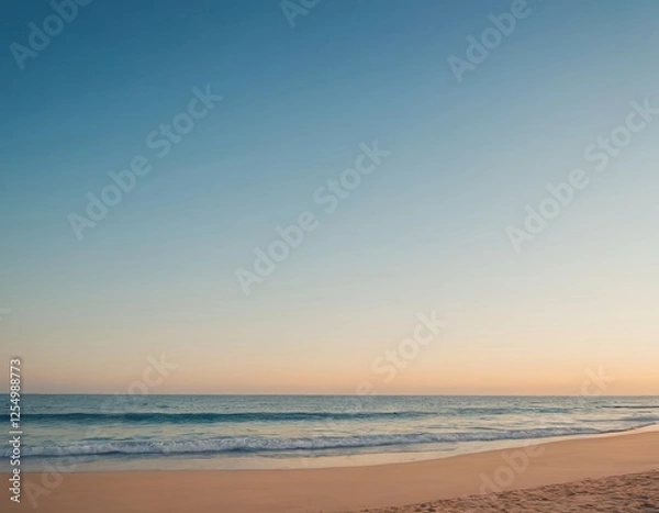 Fototapeta A serene beach scene at dusk with gentle waves lapping against the shore.