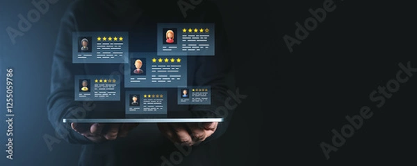 Fototapeta Digital customer feedback with star ratings displayed on a tablet screen held by a person.