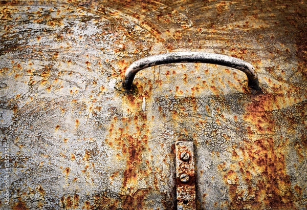 Fototapeta Handle on the old rusty iron hatch