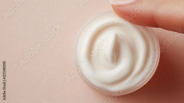 Fototapeta Elegant Fingertip Smoothing Rich Anti-Aging Cream for a Radiant Complexion in Luxurious Skincare Setting