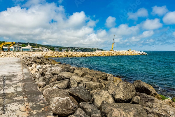 Fototapeta View of abandoned sea resort concrete buildings and structures in ruins near St. Constantine and Helena, city of Varna, Bulgaria, the shores of Black Sea, EU