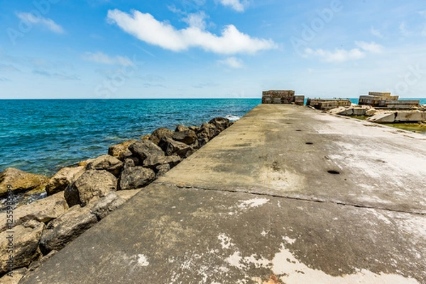 Fototapeta View of abandoned sea resort concrete buildings and structures in ruins near St. Constantine and Helena, city of Varna, Bulgaria, the shores of Black Sea, EU