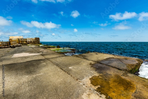 Fototapeta View of abandoned sea resort concrete buildings and structures in ruins near St. Constantine and Helena, city of Varna, Bulgaria, the shores of Black Sea, EU