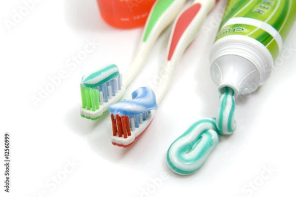 Fototapeta toothpaste and toothbrushes closeup