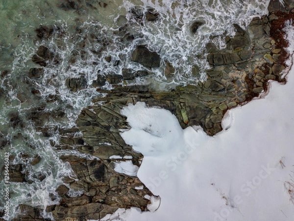 Fototapeta Artic seascape. Drone aerial top view of Winter landscape in Lofoten Islands, Norway. Color horizontal photography with amazing abstract effect. Snow and ice in wild nature.