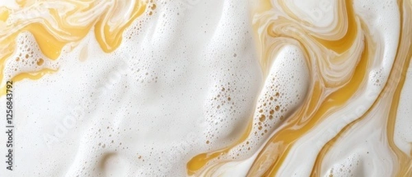 Fototapeta Swirls of honey and cream create a visually appealing texture.