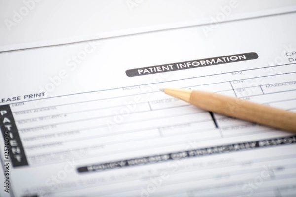 Obraz Patient information form and pen on desk,Medical questionnaire