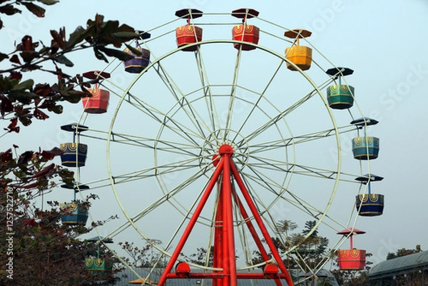 Obraz Wonder wheel in an amusement park.Ferris wheel.Ferris wheel on sky background in amusement park