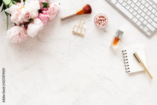 Obraz Female workspace with computer and peony flowers, top view