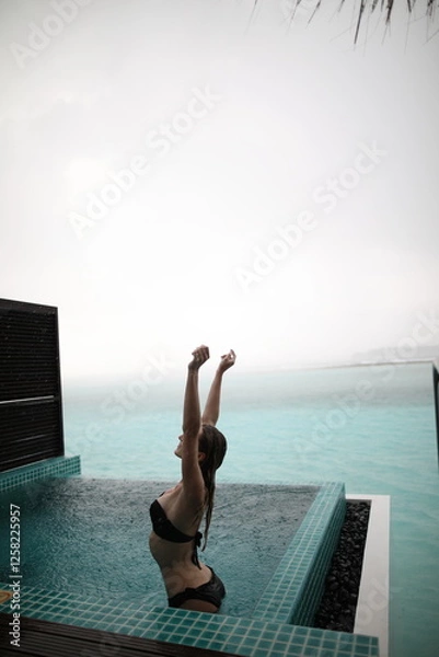 Obraz Young blonde woman when raining in maldives