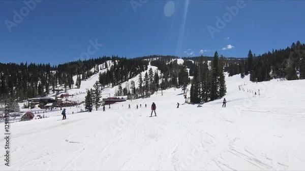 Obraz Enthusiastic Crowd Partaking In Winter Skiing Activities Down A Pristine Snow-covered Slope