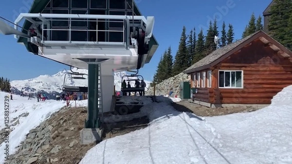 Obraz Winter Scene Of Ski Lift Transporting Visitors Up A Snow-covered Mountain Slope
