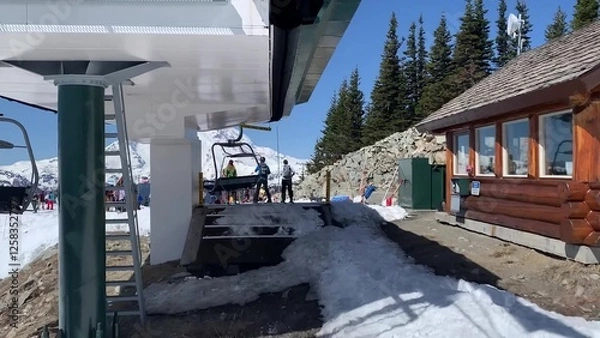 Obraz Spectacular View Of A Ski Lift Ascending A Snow-covered Hill Against Clear Blue Sky