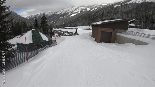 Obraz Picturesque Winter View Of Snow-covered Ski Slope With Wooden Fence And Alpine Building