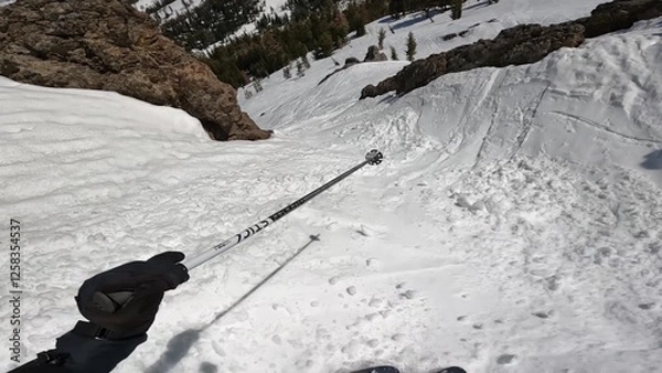 Obraz Winter Sporting Adventure: A Person Energetically Skiing Down A Snow-covered Mountain Slope