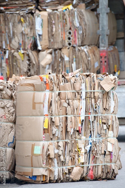 Fototapeta Heap of waste paper with strapping wire ties