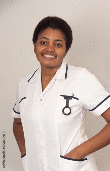 Obraz England United Kingdom, 03.02.2025. Nurse in white coat with a watch and pen in pocket.