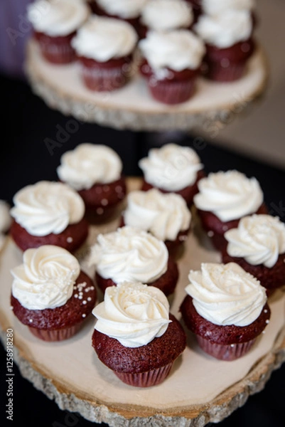 Obraz Delicious red velvet cupcakes with white icing