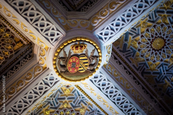 Obraz Sintra, Portugal - 09 27 2017: Pena Palace ceiling with royal crest and intricate decorative elements.