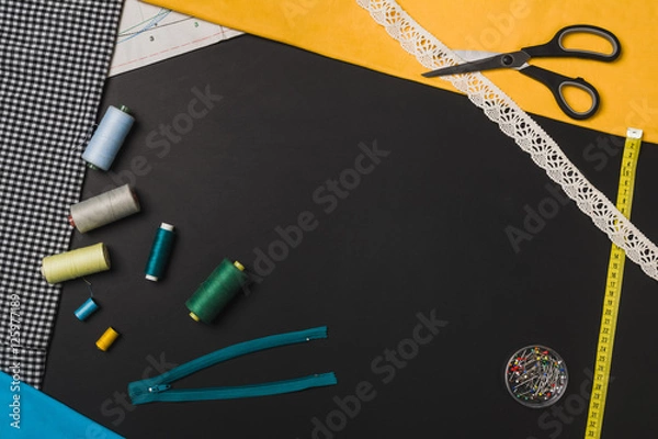Fototapeta Background with sewing and knitting tools on black chalkboard