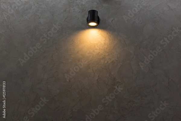 Obraz Black wall lamp on grey mortar wall background