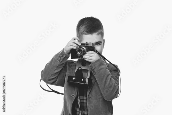 Fototapeta Handsome young boy with retro camera